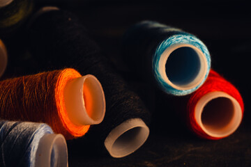 Poster - Closeup of colorful nylon threads set on a dark background