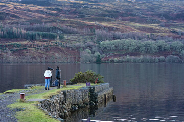 Wall Mural - Beautiful view of land near the large lake water and trees around with large hills