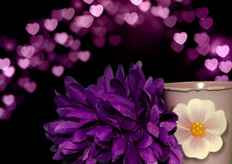 Poster - Closeup of a purple Dahlia flower next to a mug with bokeh dark background