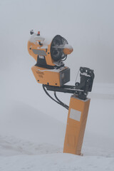 Sticker - Vertical shot of a Snow Cannon in a mountainside