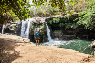 Wall Mural - Looking out at the amazing hot spring waterfall of El Salto de Malacatiupan, Atiquizaya, El Salvador