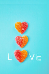 Poster - Valentine's postcard with heart-shaped marmalades on a turquoise background