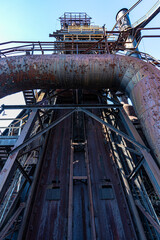 Wall Mural - Vertical shot of details of an industrial machine