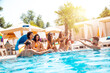 © alphaspirit - Group of friends in swimsuit enjoy in a swimming pool