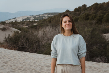 Poster - Woman traveler enjoying the sand dunes