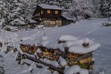 Sticker - Beautiful view of a small house on the mountain covered by snow