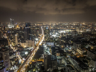 Wall Mural - Aerial view of illuminated downtown of Bangkok, Thailand