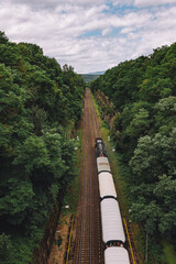 Wall Mural - Steam engine train traveling through country in summer