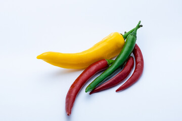 Canvas Print - Yellow, red, green peppers on a white background