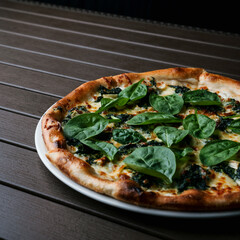 Canvas Print - Closeup of a pizza on a white plate