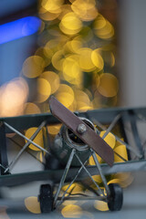 Sticker - Closeup of a toy airplane on blurred background