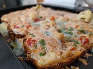 Canvas Print - Slices of double roti bread filled with vegetables and cheese