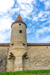 Canvas Print - Vertical shot of a historic stone building in Rothenburg ob der Tauber, Germany