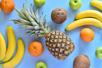 Closeup of tropical fruits on blue background