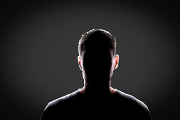 dark backlight shadow silhouette of male person, incognito unknown profile