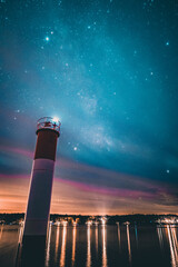 Wall Mural - Closeup of a lighthouse with beautiful sky background