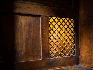 Sticker - Closeup of a wooden window of the confessional box at church