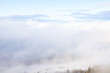 View of the foggy sky with clouds and mist during winter season