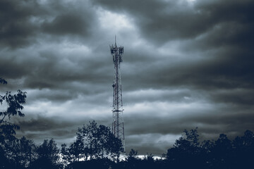 Poster - Beautiful shot of a signal tower with stormy clouds