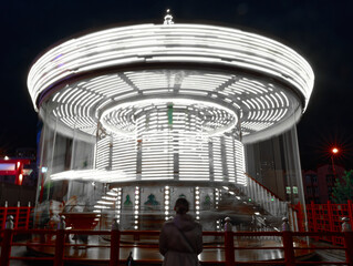Closeup of an illuminated attraction in a motion