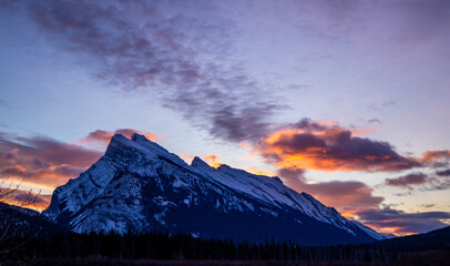 Canvas Print - Tranquil landscape of a majestic snow covered mountain  at sunset