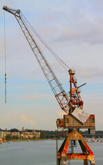 Poster - Vertical shot of a harbor crane on a sunny day in summer