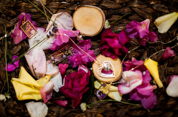 Sticker - Closeup shot of a romantic box with jewelry and petals