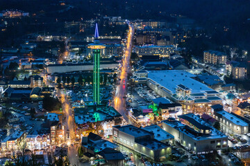 Wall Mural - Aerial view of colorful lights from city buildings and structures at dawn