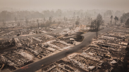 Wall Mural - Smoke filled skies overlooking the aftermath and tragedy of a wildfire that blew through small town