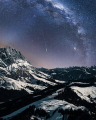 Canvas Print - Beautiful shot of the Milky Way over the snowy rocky mountains at night