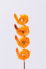 Poster - Roasted peel prawn skewer sticks isolated on a white background