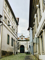 Canvas Print - View of classical architecture and old church against cloudy sky