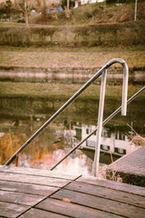 Sticker - Closeup of stairs leading to a lake