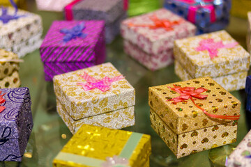 Canvas Print - Closeup shot of colorful jewelry boxes on a blurred background