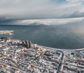 Wall Mural - Vertical shot of a city covered by snow