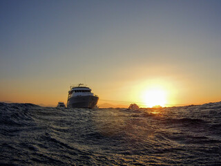 Sticker - Beautiful shot of ships in the Red Sea after an evening dive in Egypt with sunset in a background