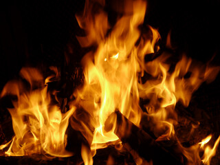 Canvas Print - Close-up shot of fire flames on black background