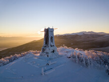 Serene Landscape Of The Snow Covered Shipka Summit In Bulgaria At Sunset