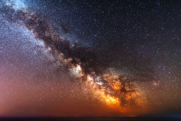 Canvas Print - Galactic center of the milky way with many colors on a starry sky in deep space