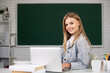 © Volodymyr - Portrait of smiling young college student studying in classroom. Webinar e-learning at school, distance education.