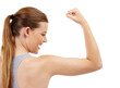 My bicep muscles are getting stronger. A teenage girl checking out her bicep muscles after a workout.