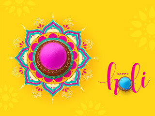 Sticker - Indian festival of colours, Happy Holi concept, a traditional pot with full of dry colours(gulal) on beautiful mandala(rangoli) and vibrant yellow background.