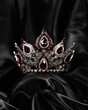 Crown for miss beauty, a symbol of power and elegance, competition, show. Tiara in white metal and red stones on a black draped satin background