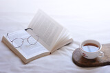 Fototapeta  - cup of coffee and book
