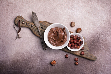 Wall Mural - Tasty chocolate cream or sweet nut butter with whole hazelnuts