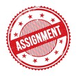 ASSIGNMENT text written on red grungy round stamp.