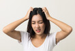 © Chanakon - Young woman itchy head There is a fungus on the scalp dandruff, red rash She scratched her head to bring relief. Need to consult a doctor. Hair problems hair loss. Shot on isolated background