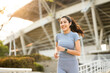 © Chanakon - Attractive beautiful woman wearing sportswear running at sport stadium. Fit woman jogging outdoor. Workout exercise in the morning. Healthy and active lifestyle concept.