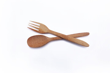 wooden spoon and fork on white background