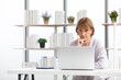 © offsuperphoto - senior woman using laptop computer and serious at work